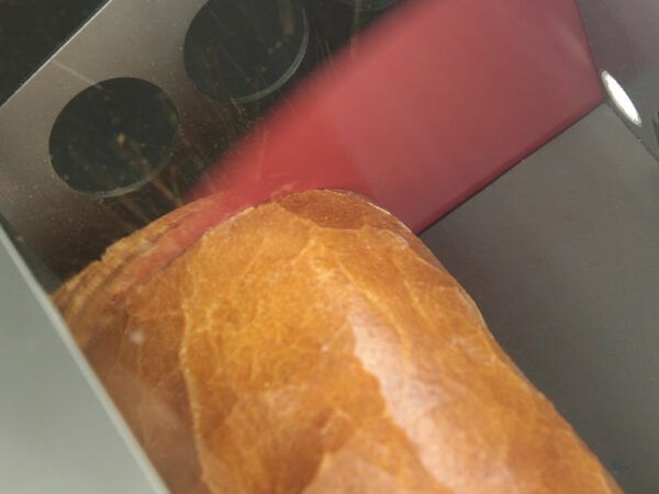 Licing Bread In Bread Cutter